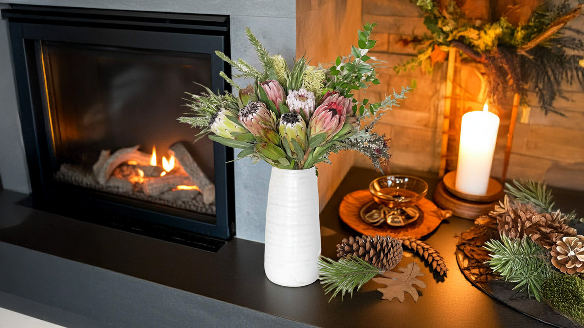 Buy Protea Bouquet - protea arrangement next to a fireplace